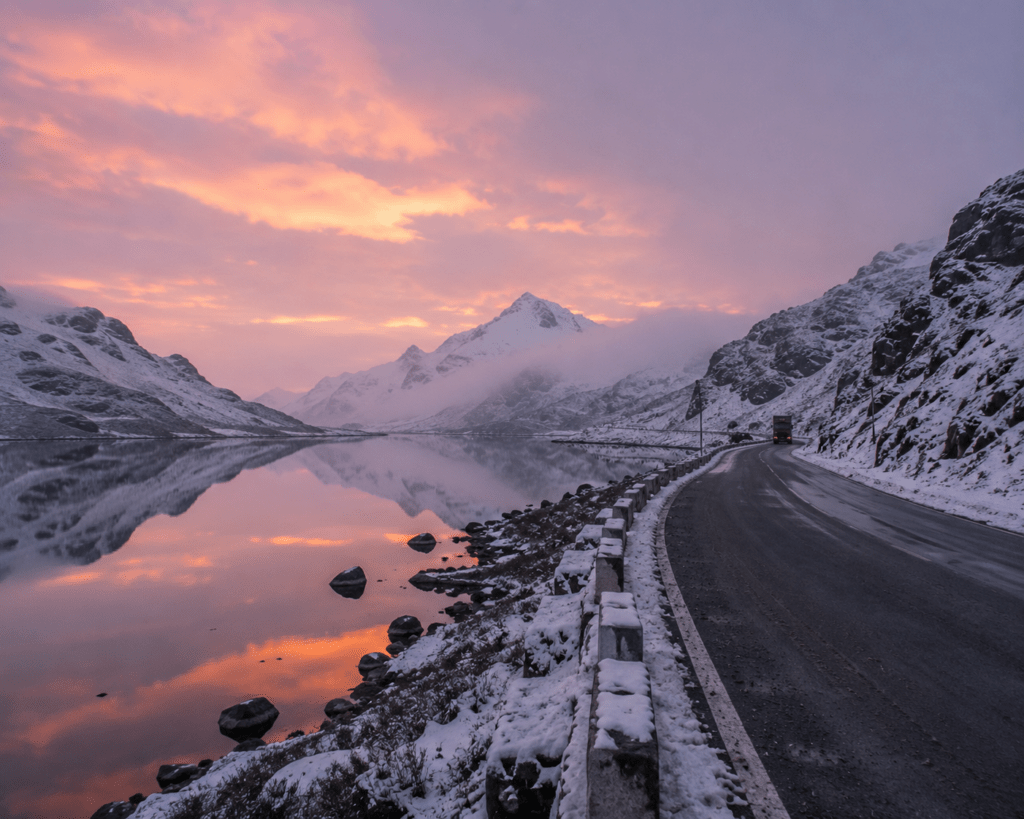 Sela Pass at dawn on the Tawang road — the glacial Sela Lake - Indias Greatest Roads to ride travel guide 2026