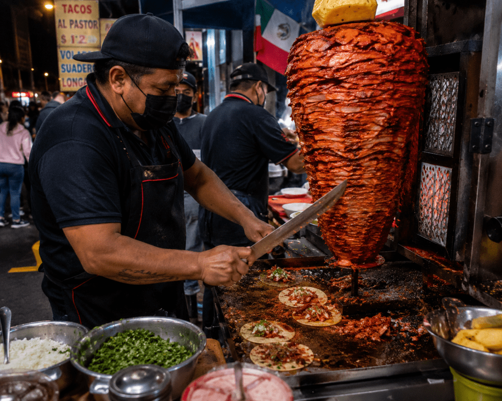 Tacos al Pastor being prepared on the Mexico City street - Before You Die: A Complete World Food Bucket List 