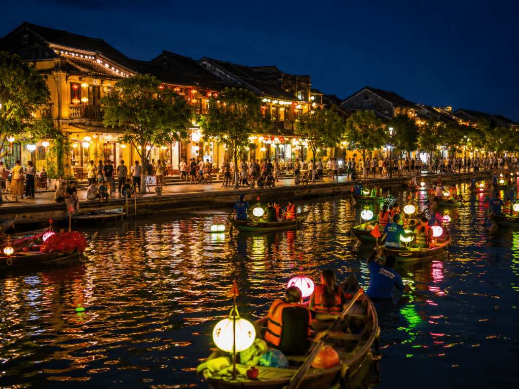 Hoi An ancient town canal lit with lanterns at night